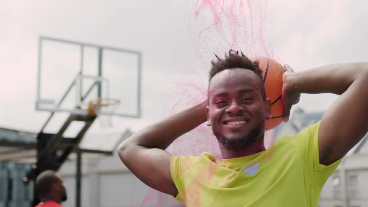 Sports player placing ball behind head summoning pink swirl, teammate shooting ball toward hoop