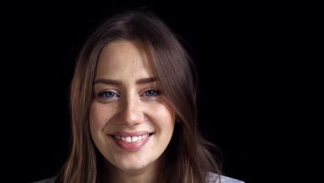 Close-Up-Of-Attractive-Young-Woman-Laughing-Into-Camera