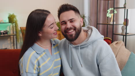 Portrait-of-happy-smiling-family-marriage-couple-man-woman-looking-at-camera,-hugging,-embracing