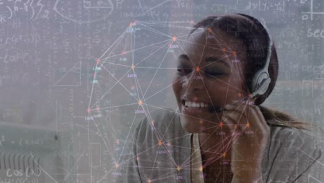 animation of network of connections over businesswoman with headset in office