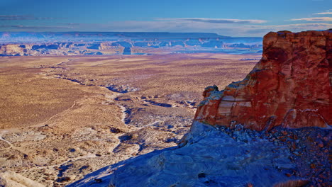 the aerial perspective highlights glen canyon’s intricate rock formations and the shimmering expanse of lake powell.