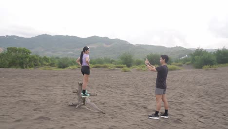 couple taking photos at scenic sand dunes