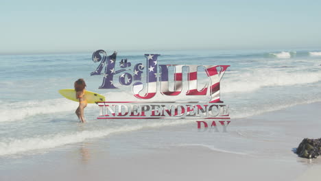 american flag waving over independence day text against woman with surfboard on the beach