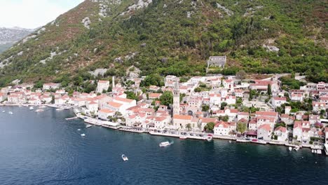 perast ancient unesco city at bay of kotor, montenegro - aerial circling pan