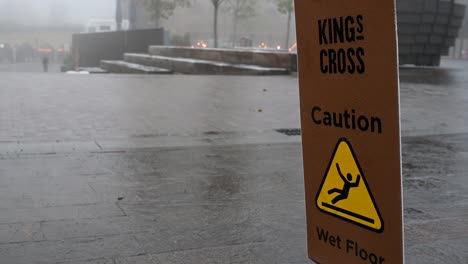 Caution,-Wet-Floor-in-the-Fog-near-to-Kings-Cross,-London,-United-Kingdom