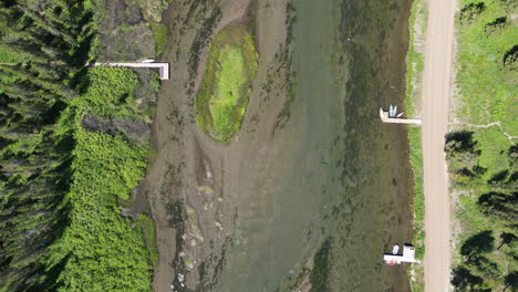 Clear-Water-Boating-River-with-Boat-Docks-on-the-Edges-of-the-Still-Water