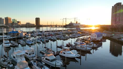 Freedom-Boat-Club-in-Portsmouth-with-a-view-of-downtown-Norfolk,-Virginia-skyline-during-sunrise