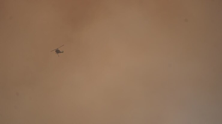 Helicopter Flying into Sunset hd