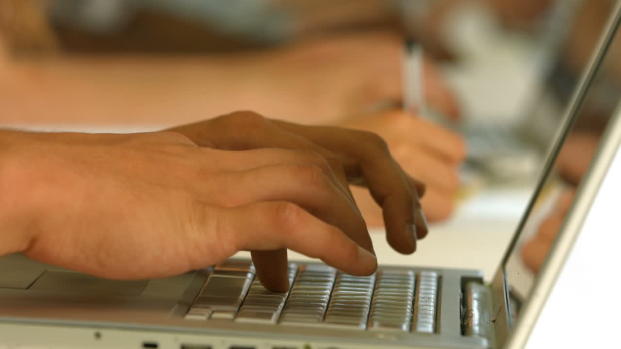 Students taking notes in lecture