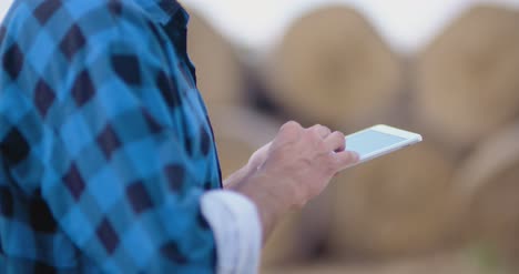 Midsection-Of-Male-Researcher-Using-Digital-Tablet