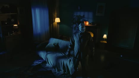 maniac with knife walking through room girl comes out from the next door scaried face looking - horror movie scene in the apartment creative concept. maniac with knife walking through room, girl comes out from the next door, scaried face looking directly at the security cam, asking for help. r bt202