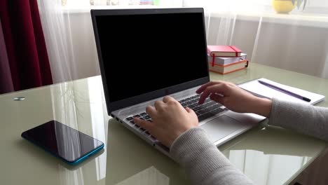 the girl working at home office hands on keyboard. alpha channel included.  you can insert your background.