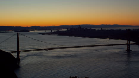 golden gate bridge at sunrise looking over san francisco