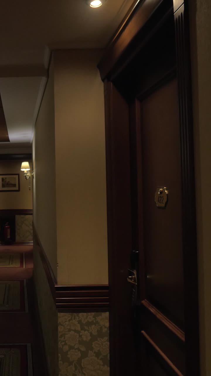 Empty Hotel Hallway with Classic Decor and Dim Lighting