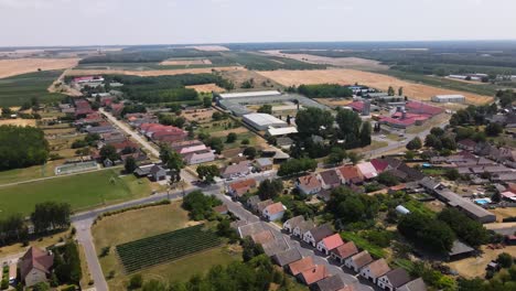 drone view of nemesnadudvar town and surrounding countryside fields in hungary