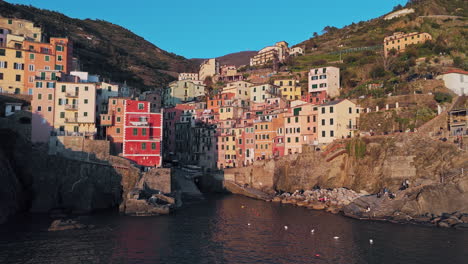 colorful houses of riomaggiore village with the sea in cinque terre region