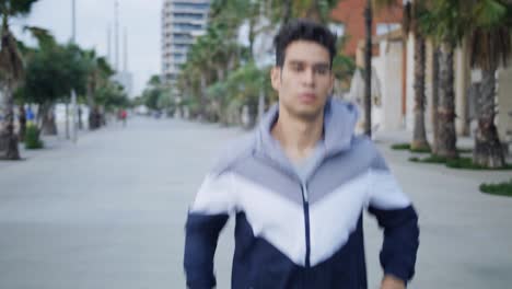 young attractive athlete running and doing exercises on bridge in the morning