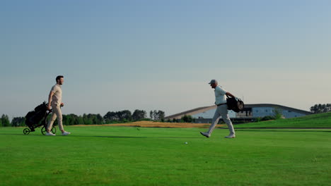 golf players meeting together on course field. golfing team talking sport game.