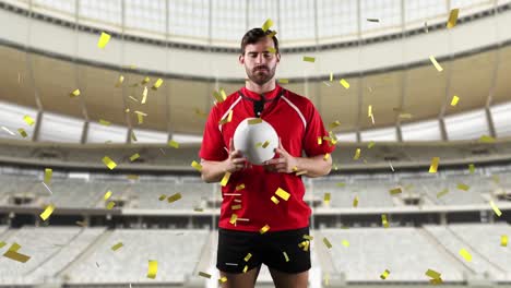 professional rugby player standing in front of a stadium with confetti falling