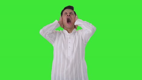 stressed indian man shouting loud green screen