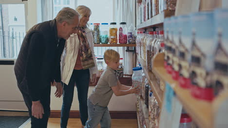 family shopping for sweets at a candy store