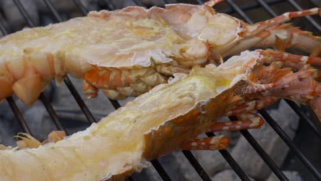 Thailand-street-restaurant-booth-grilled-lobster-on-coal-cooking-tilapia-on-charcoal-fire