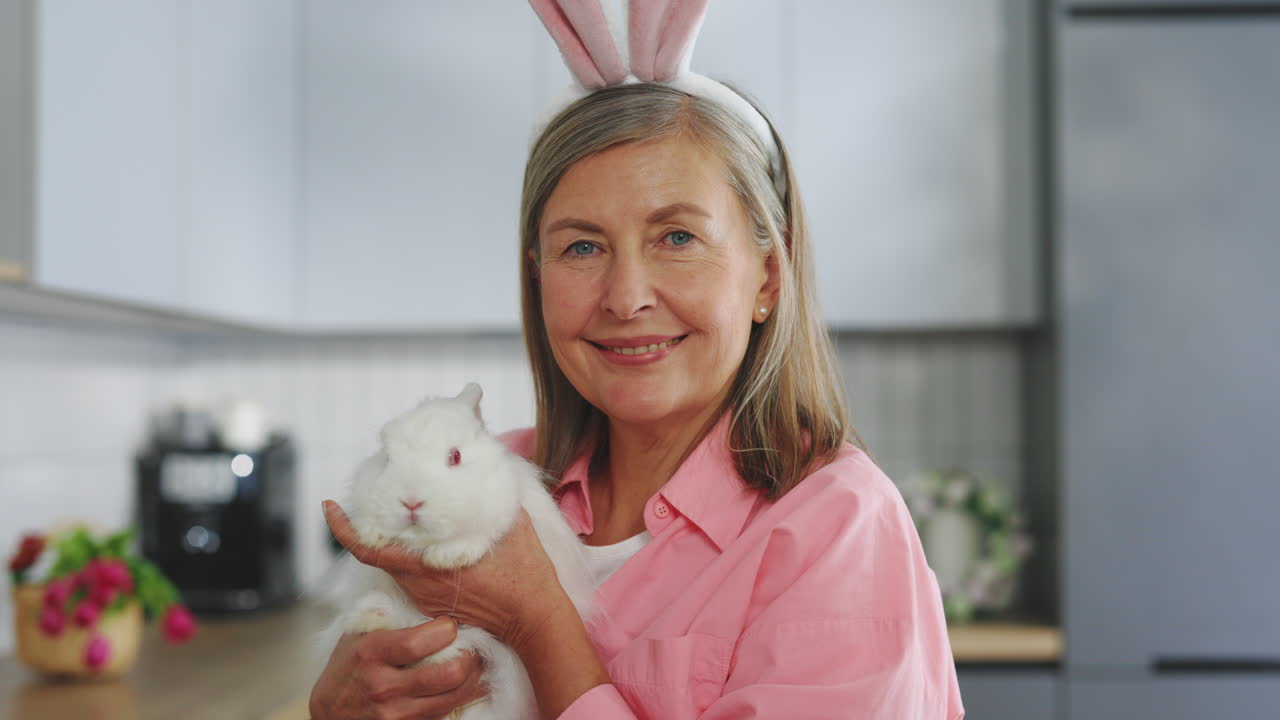 Woman and rabbit in kitchen