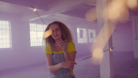 fashionable young woman in an abandoned warehouse