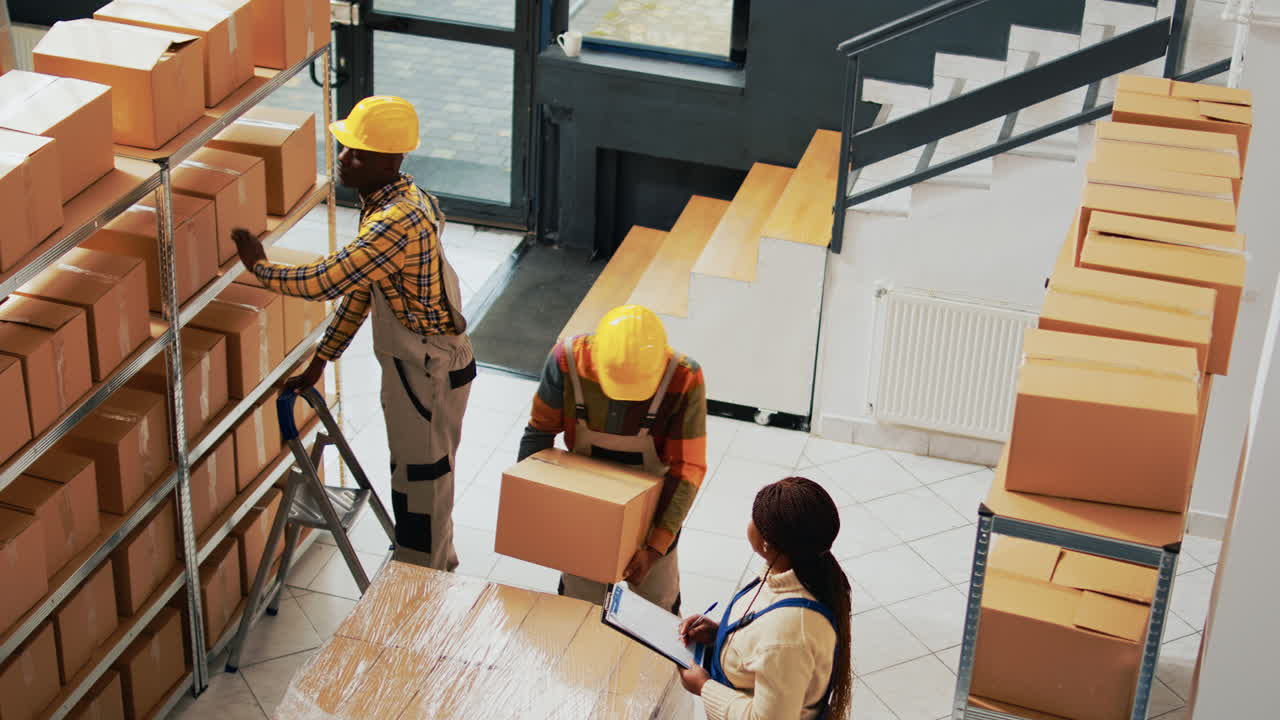 Warehouse workers organizing boxes on shelves