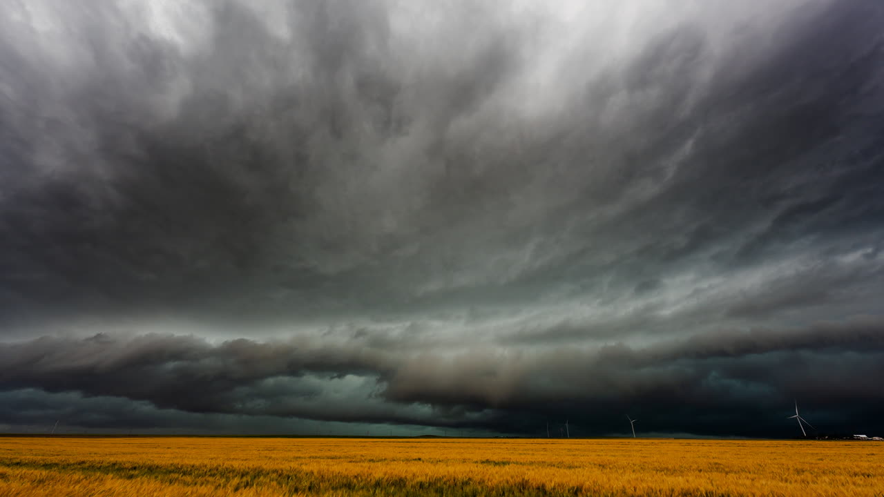 Dark atmospheric sky with storm clouds and shadows creating a powerful dramatic weather scene