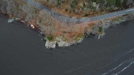 aerial view from beach with boat and rocks