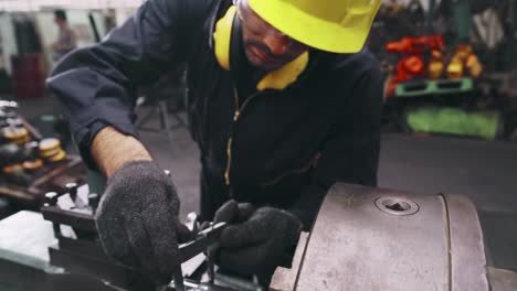 smart factory worker using machine in factory workshop