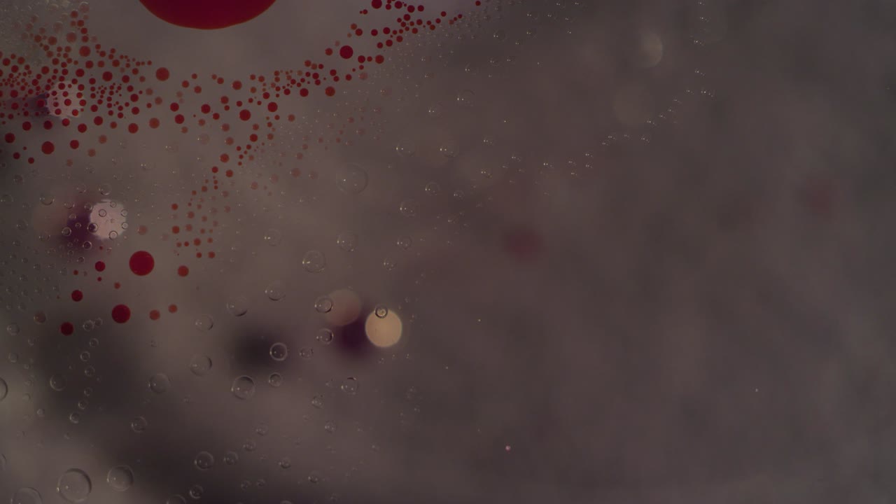 fondo de textura de movimiento de burbujas líquidas macros rojas y claras