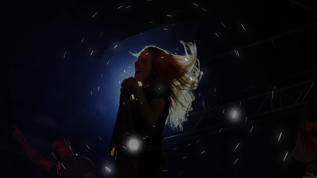 Duet singers performing music on stage, showing animated microphone, headphones, light streaks