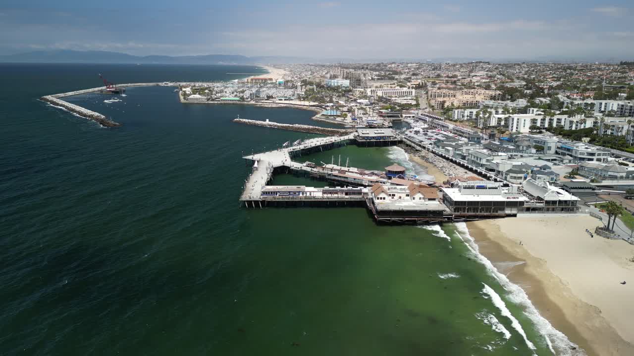 Aerial 4K drone footage of Redondo Beach Pier in Los Angeles, California, showcasing the Pacific Ocean, coastline, marina, and iconic waterfront landmark from scenic elevated views