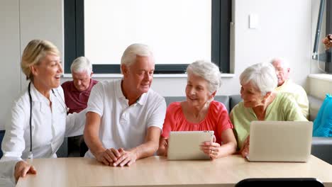 female doctor interacting with senior citizens