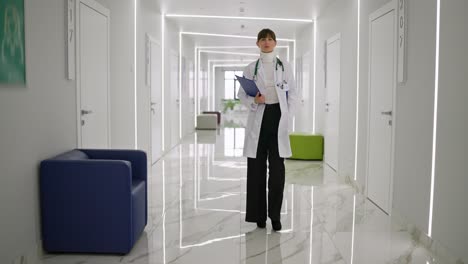 doctor walking down a hospital hallway