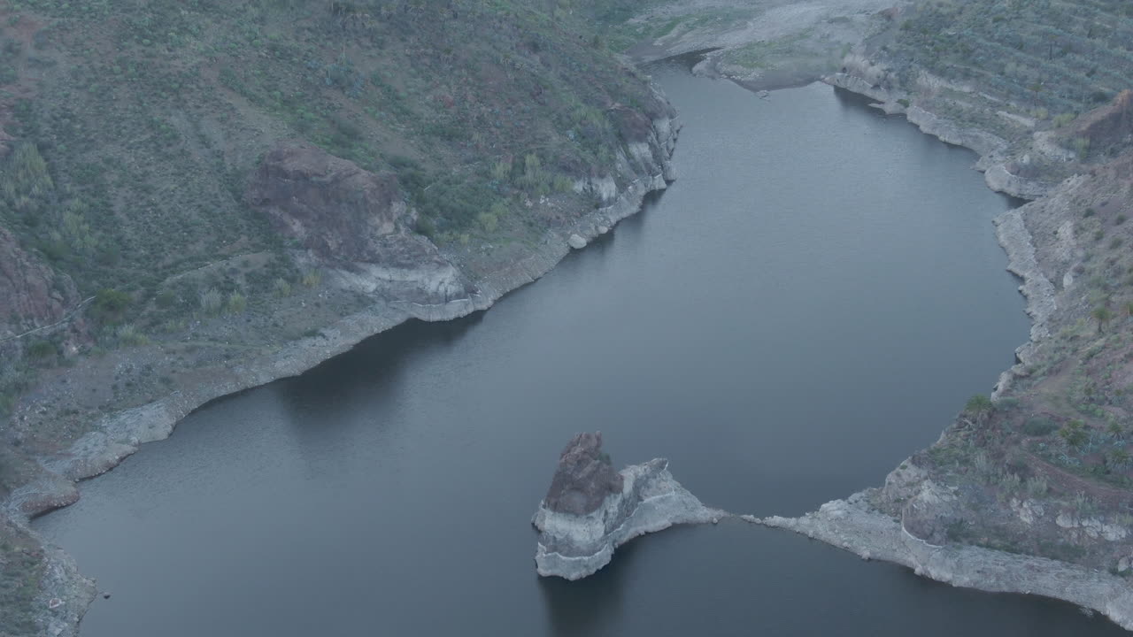 Sorrueda dam, Gran Canaria: aerial view over the famous dam with completely calm water