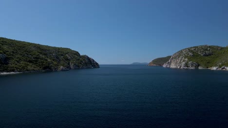 Cinematic-forward-moving-4K-drone-clip-over-the-tropical-blue-waters-of-Toroni-in-Chalkidiki