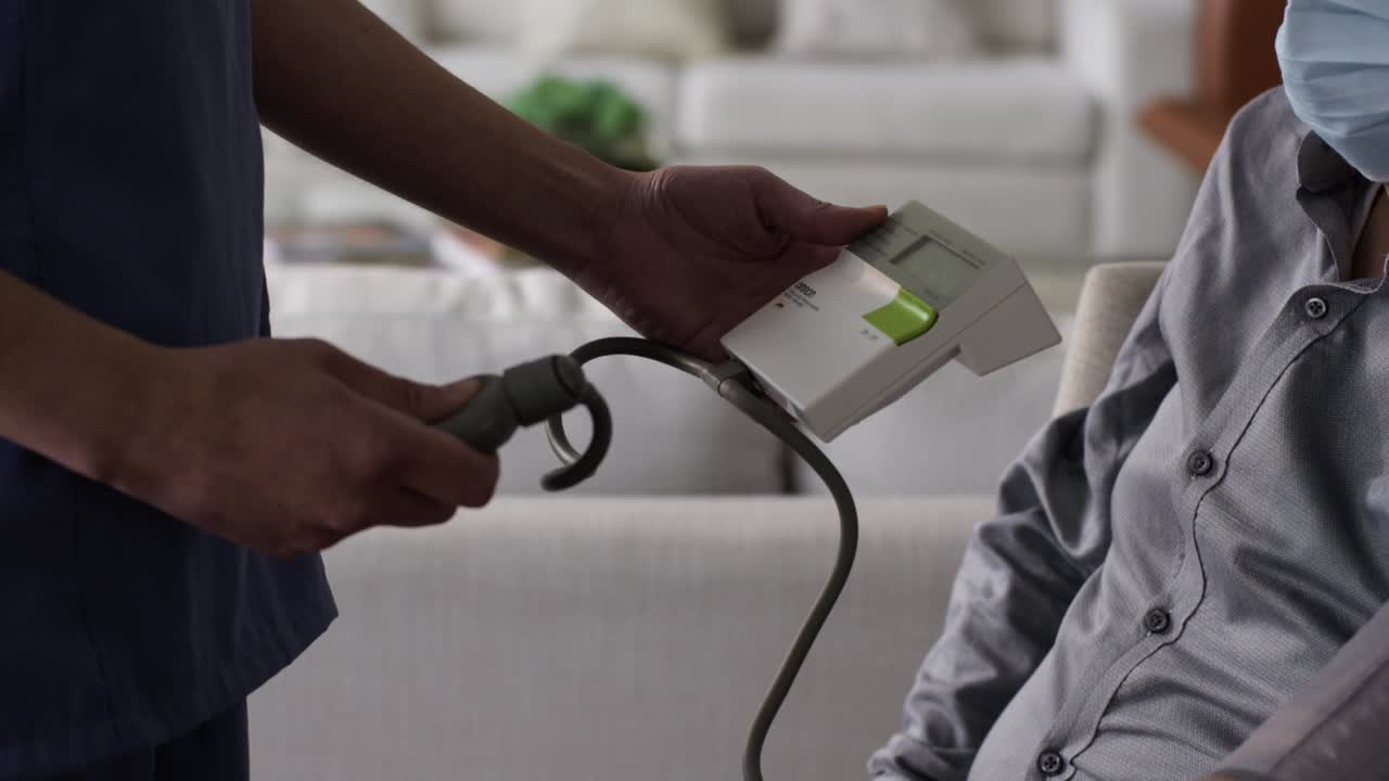 Checking a patient's blood pressure, health insurance concept