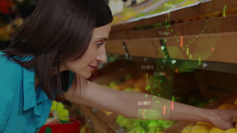 stock market data animation over woman selecting produce in grocery store