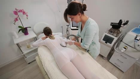 vacuum-roller body massage in the clinic of modern cosmetology