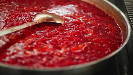 cooking delicious beetroot soup (borscht)