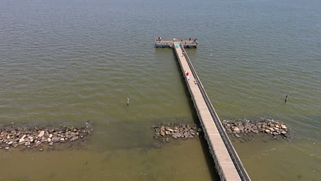 aerial shot of fishing pier and breakwater