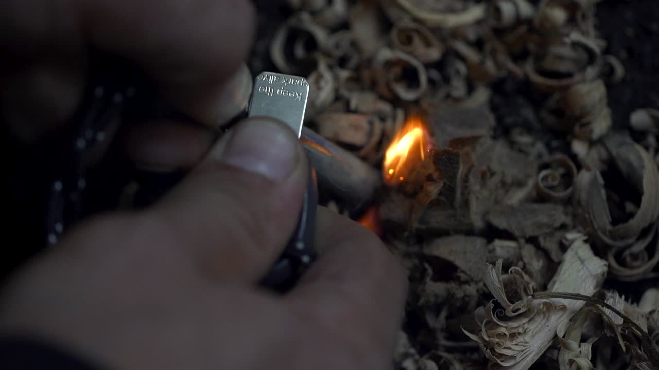 SLOWMO macro close up of flint rod being used to light fire