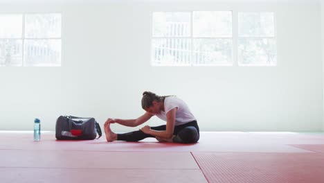 caucasian woman stretching before training