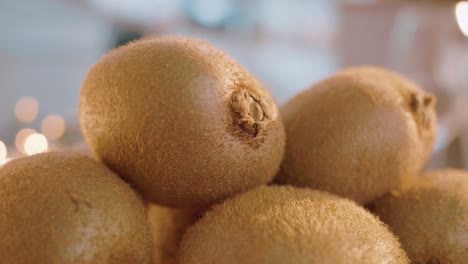 a bunch of fresh whole stacked kiwifruits, close up shot