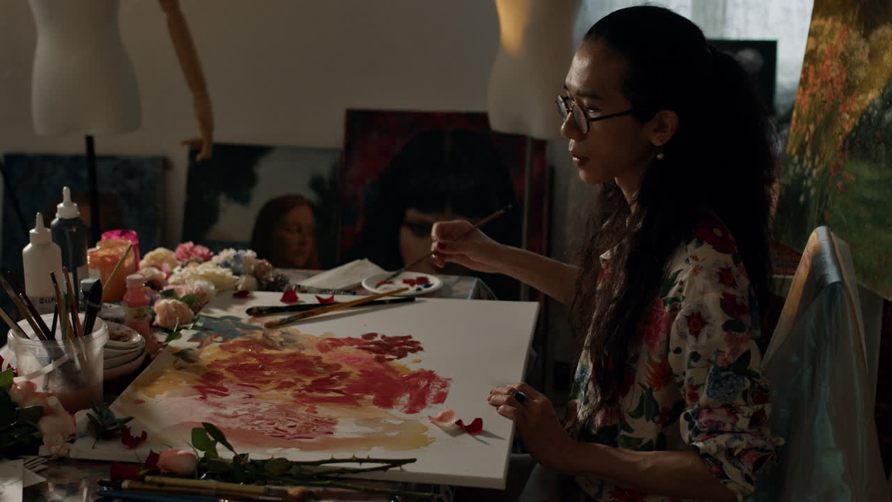 Artist painting in cozy studio with focus and creativity