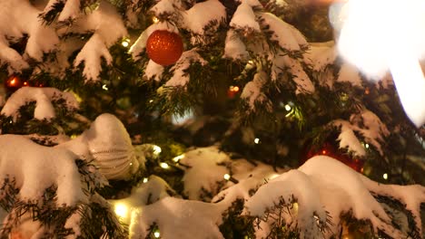 christmas tree in snow, sparkler firework burning, new year or xmas bengal light