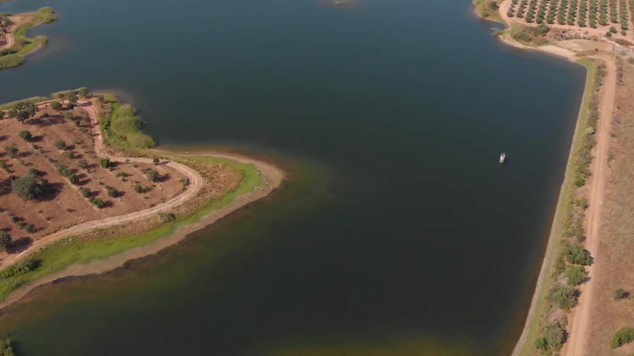 Aerial flyover showing dry lake during hot summer in Portugal.Global warming concept.
